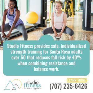Two women exercise with weights in a gym. Text promotes individualized strength training for adults over 60 at Studio Fitness in Santa Rosa to reduce fall risk by 40%. Contact info included.